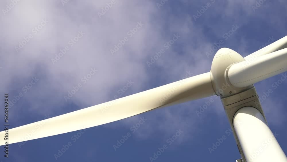 Close up Of Rotating Blades Of A Windmill Propeller On Blue Sky Background Close up Of Rotating Blades Of A Windmill Propeller On Blue Sky Background