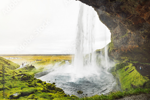 Looking at the waterfall from under the rock - Iceland