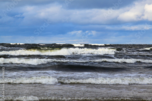 Waves on the sea on windy cloudy day. Selective focus