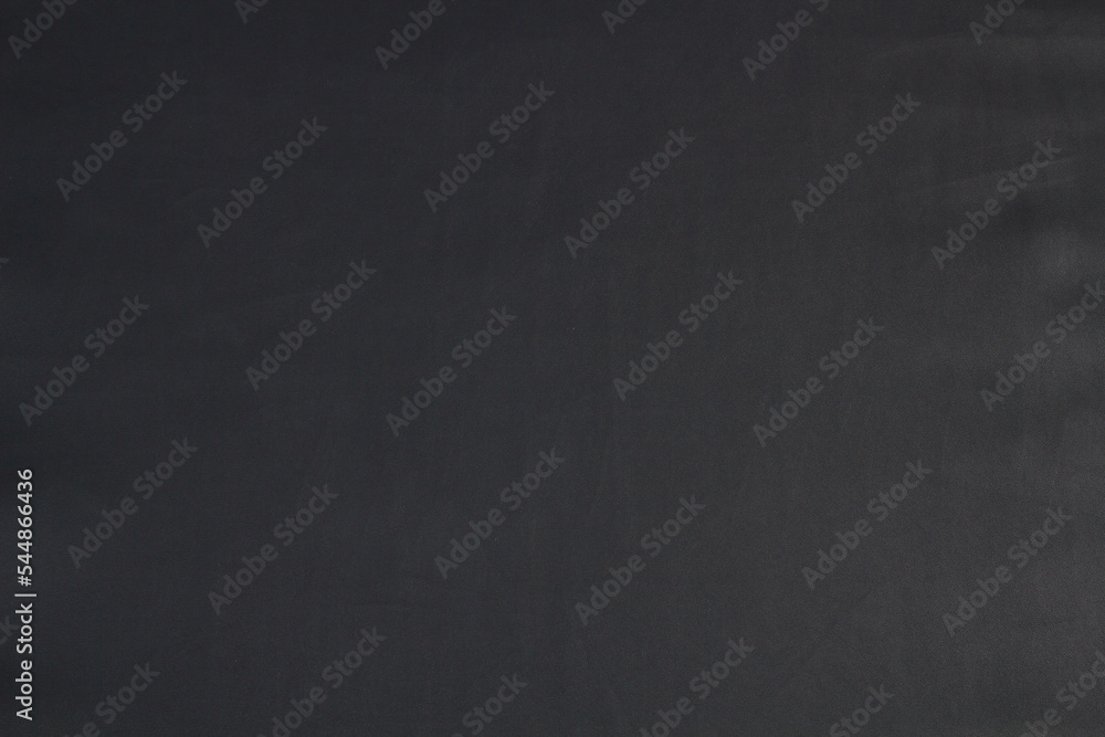Black leather background texture close-up