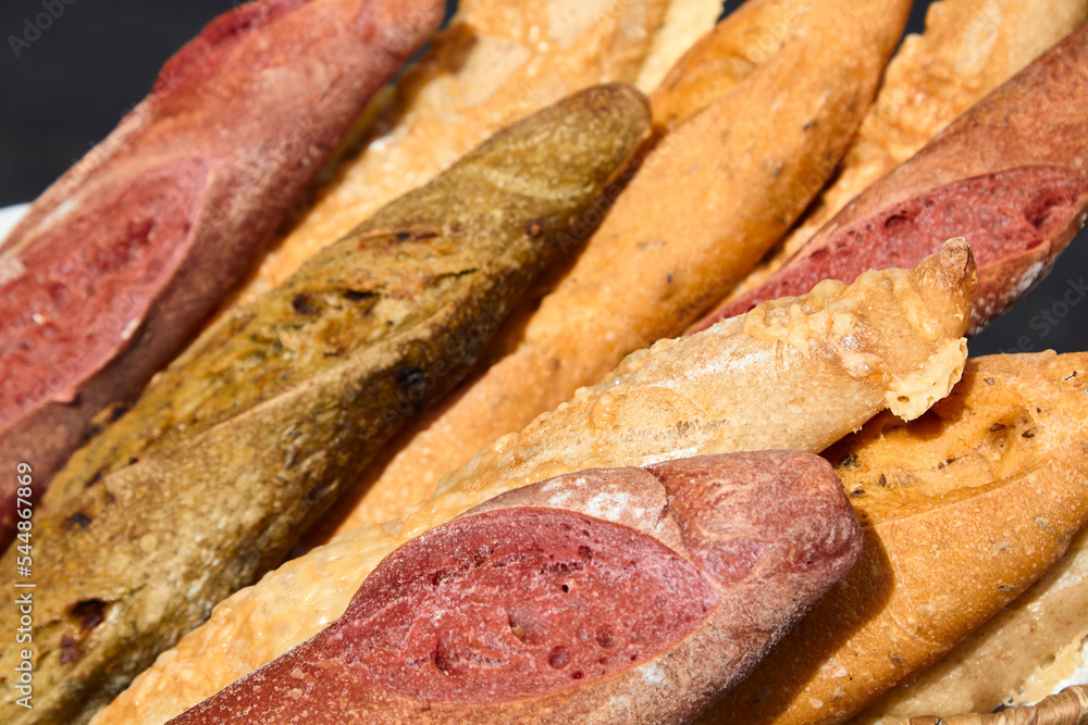 Different types of delicious baguette bread. Selective focus