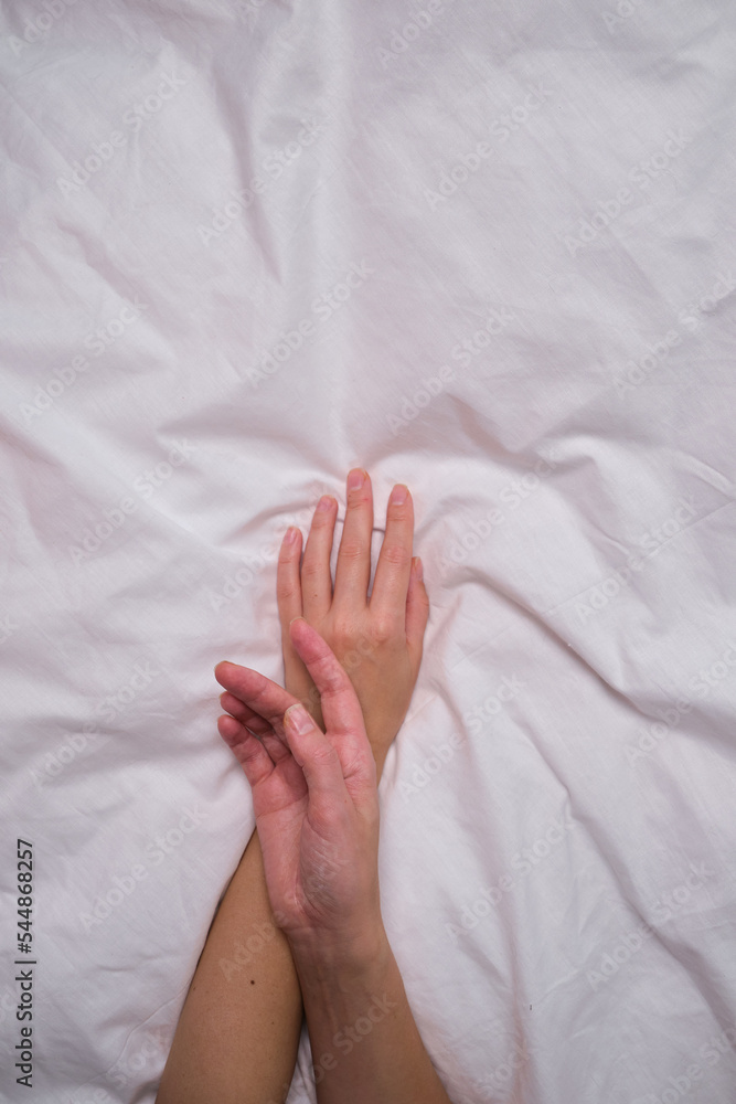 Beautiful female hands on a light background. Aesthetics of minimalism. The concept of spa, wedding salons, hand treatments Beautiful female hands on a light background. Aesthetics of minimalism. The concept of spa, wedding salons, hand treatments