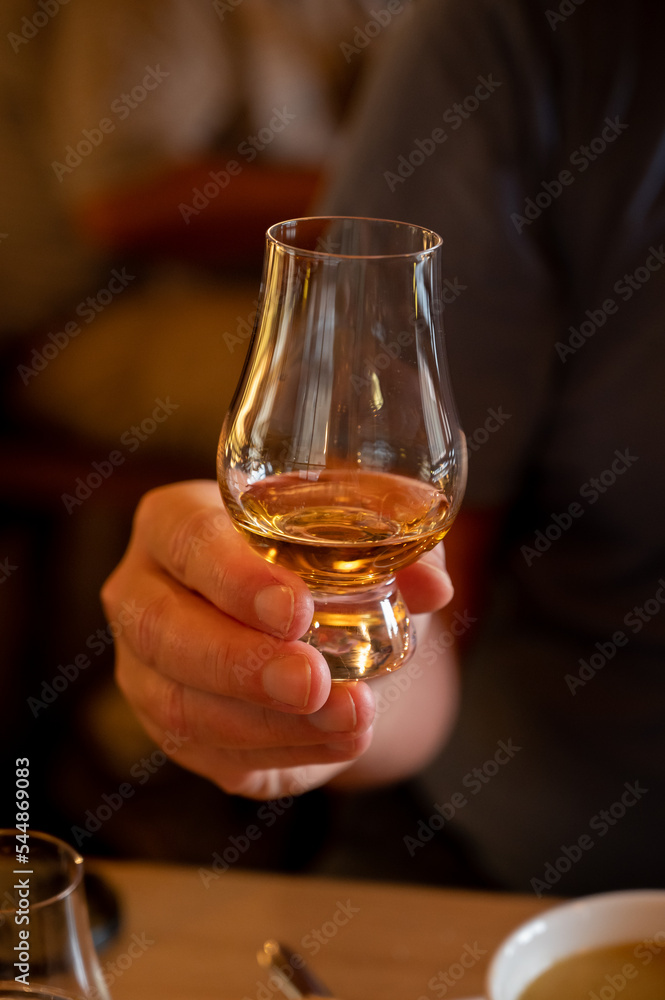 Tasting of single malt scotch whisky in whiskey bar in Edinburgh, UK