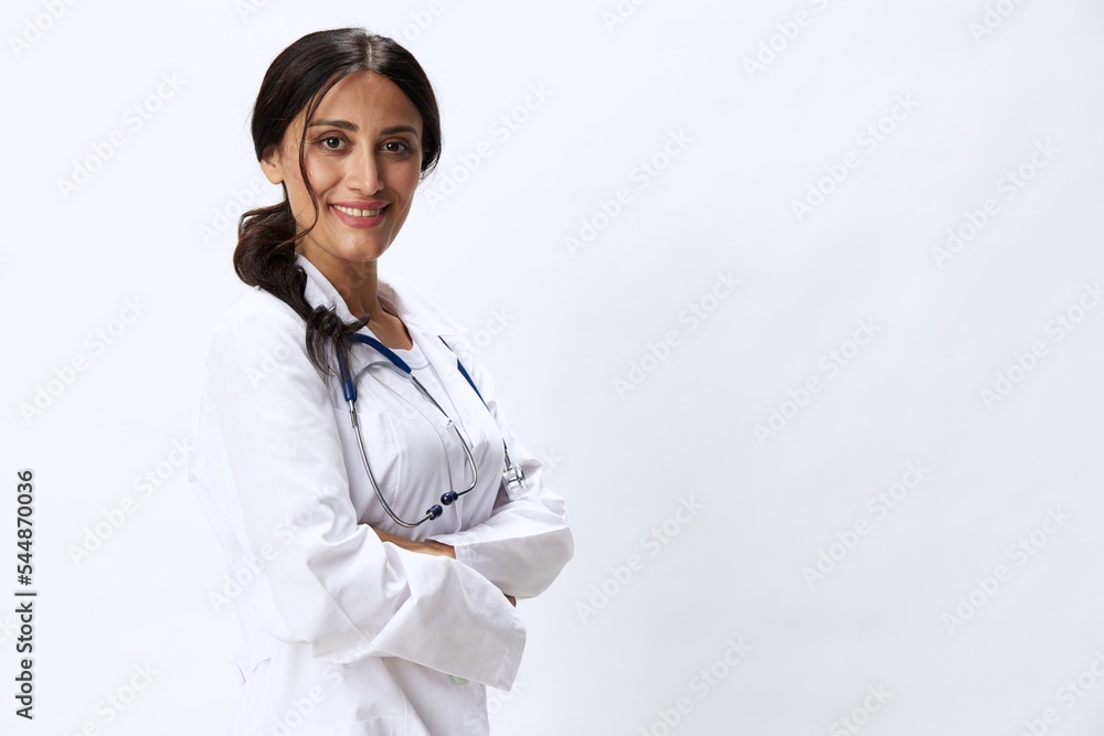 Woman doctor with stethoscope in hand in medical gown on white nurse background, consequences of covid-19, noise in lungs, concept of health and science Woman doctor with stethoscope in hand in medical gown on white nurse background, consequences of covid-19, noise in lungs, concept of health and science