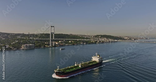 Istanbul Turkey Aerial v61 drone flyover bosphorus strait capturing tanker ship on the waterway and busy traffic crossing on martyrs bridge with cityscape view - Shot with Mavic 3 Cine - July 2022 photo