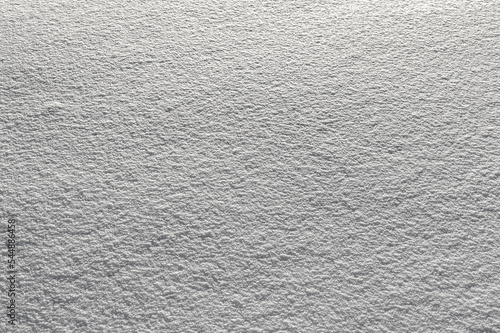 Smooth surface of the fallen snow. Natural snow color and texture