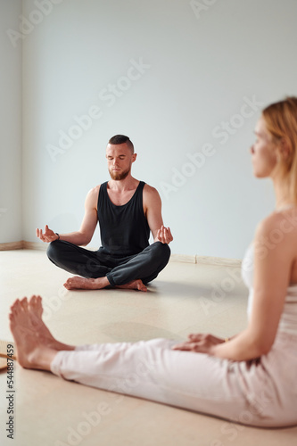 Group of people meditation after yoga practice of standing on sadhu board with shapr nails. Alternative medicine acupressure, recovery strength photo