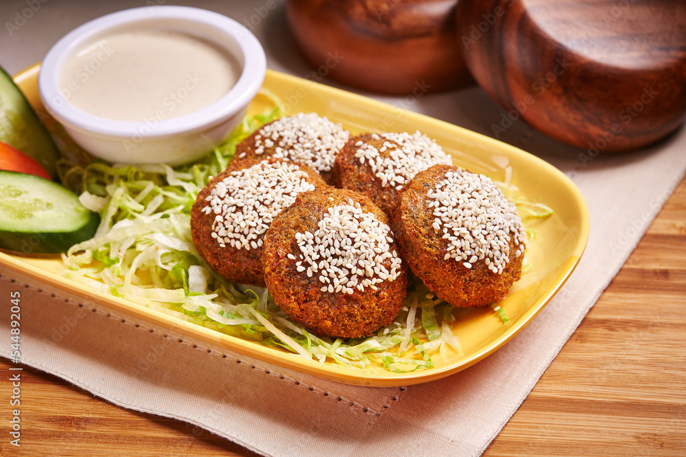 falafel or falafil with salad and dip served in dish isolated on table side view of middle east food