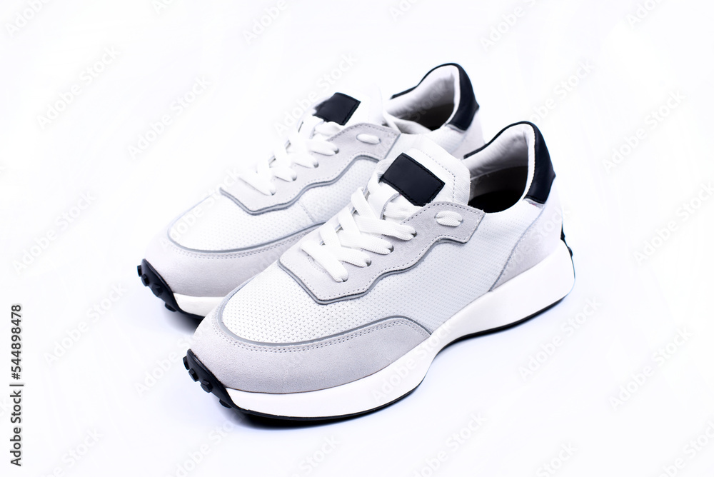 Sneakers White mowing on a white background. Sports shoes. Sneakers White mowing on a white background. Sports shoes.