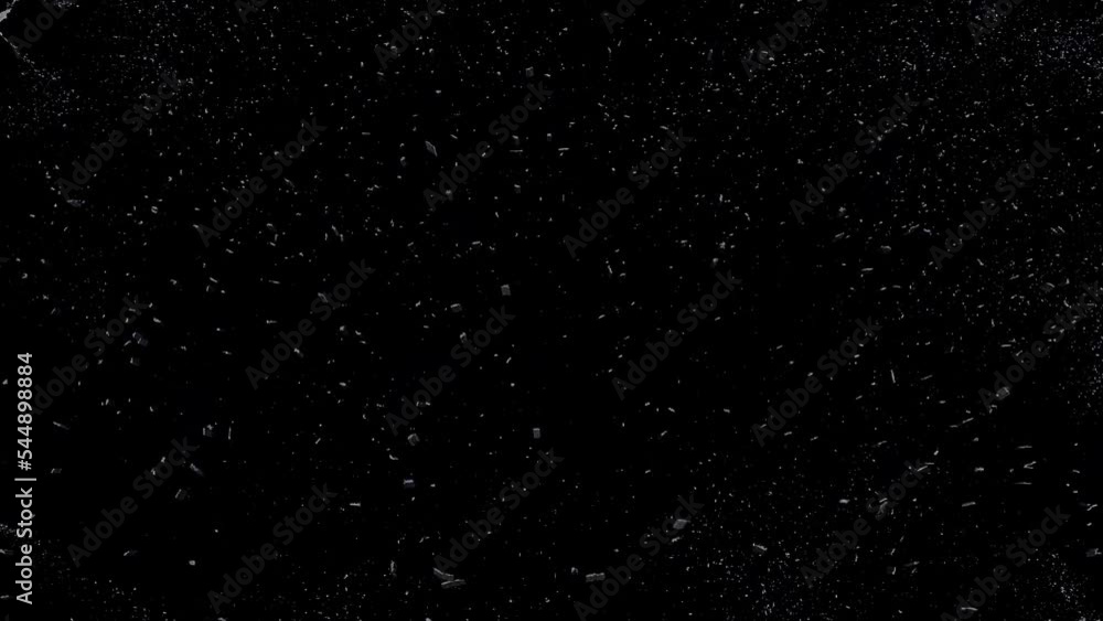 white falling fine grains scattered on a black background. falling snow flakes white falling fine grains scattered on a black background. falling snow flakes