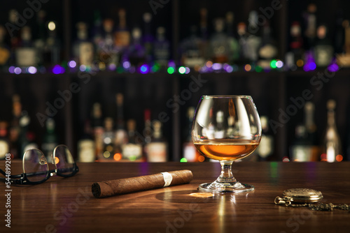 close up view of cigar and glass of whiskey on color back.  © Dmitry Ersler