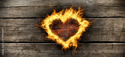 Burning heart of flames with flakes charring hardwood background
