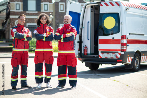 Photography Joyous paramedics in the uniforms standing outdoors