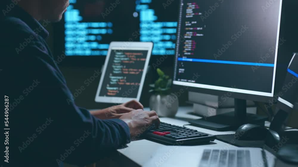 Young Asian man, developer programmer, software engineer, IT support, working hard at night overtime on computer to check coding in bugging system