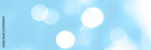Blurred lights blue background  banner texture. Abstract bokeh with soft light header. Wide screen wallpaper. Panoramic web banner with copy space for design