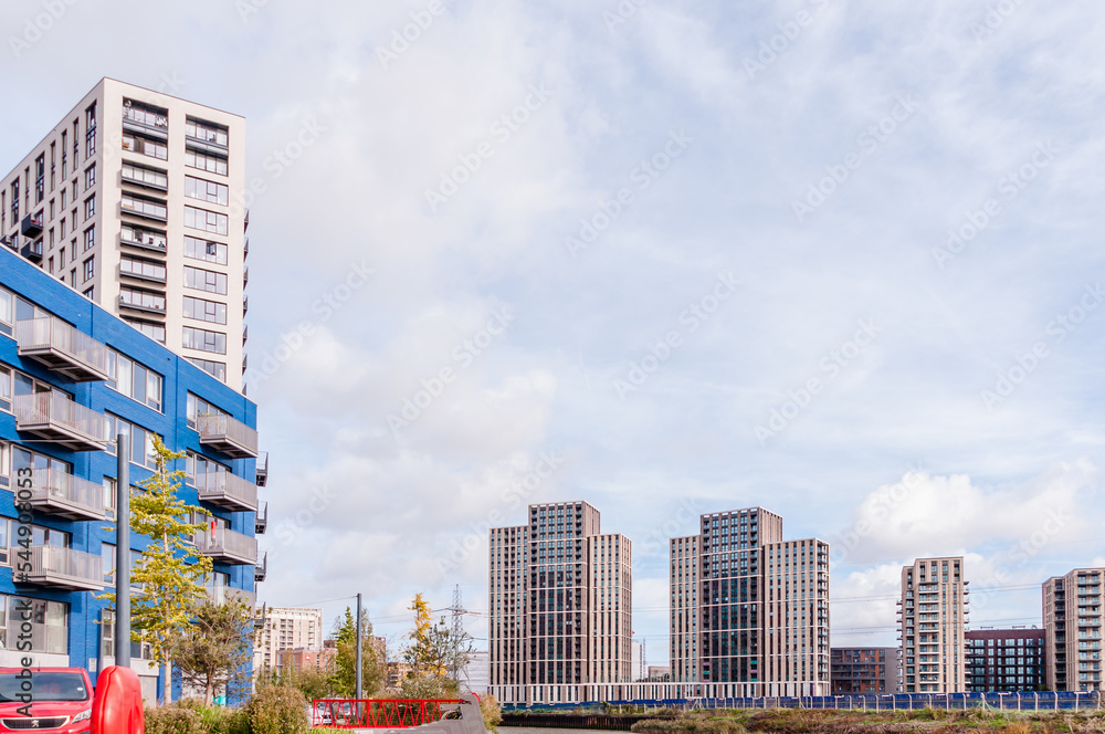 london, united kingdom, october 22, 2022: city Island residential development on the river lea at canning town, london. shows harmony building on the (left) and on city island way - obrazy, fototapety, plakaty 