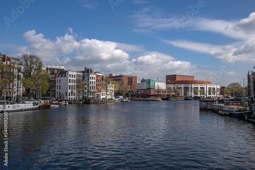 Obraz na plátně City Scene At The Amstel River Amsterdam The Netherlands 2019