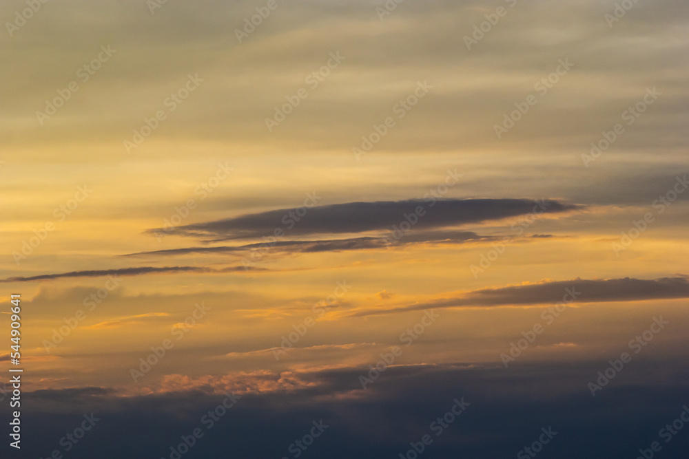 sunset sky with multicolor clouds. Dramatic twilight sky background