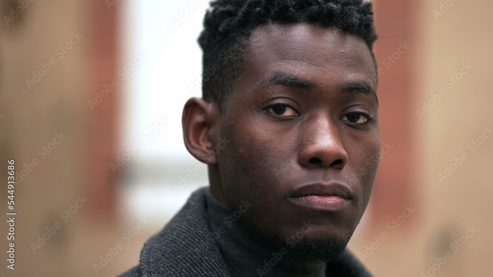 Black man staring at camera close-up face Black man staring at camera close-up face