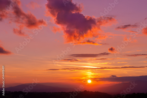 Light clouds against the background of a bright sunset in the Tatra Mountains