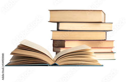 An open hardcover book and a stack of books on a white background.