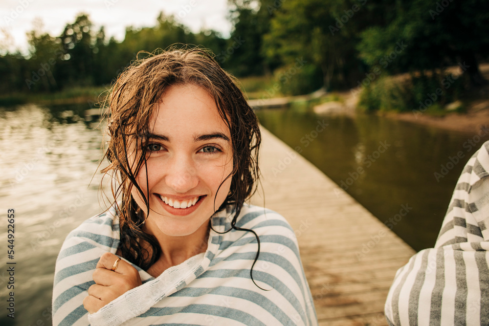 Portrait of smiling girl wrapped in towel during vacation Portrait of smiling girl wrapped in towel during vacation