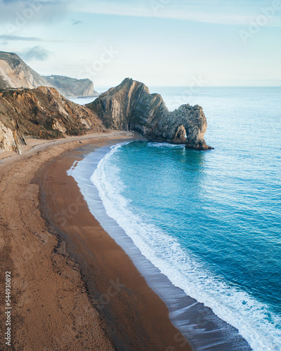 Durdle Door, South Coast, Jurrasic Coast, Dorset, UK. Aerial view of rugged coastline and sea stacks. Jigsaw like Rock formations