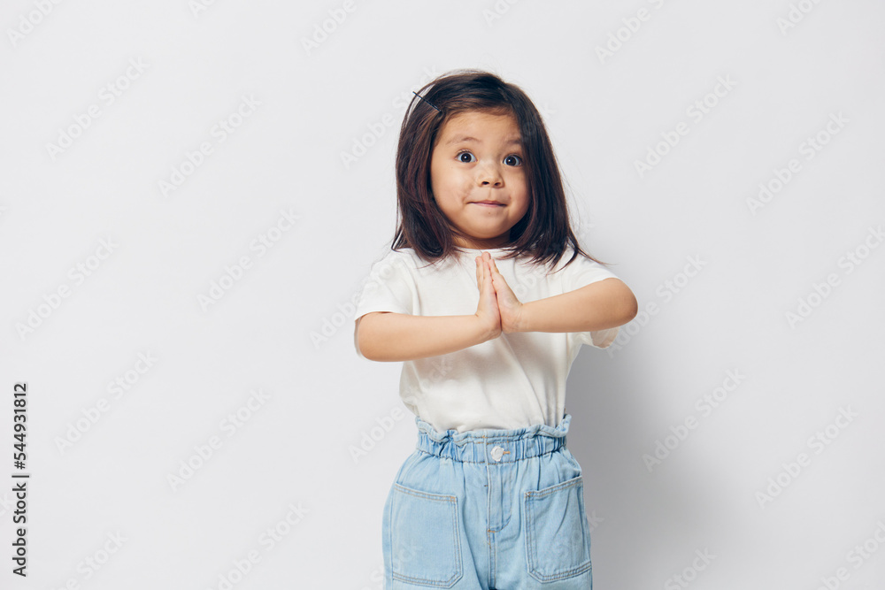 portrait of a little girl happily posing with her arms folded across her chest portrait of a little girl happily posing with her arms folded across her chest