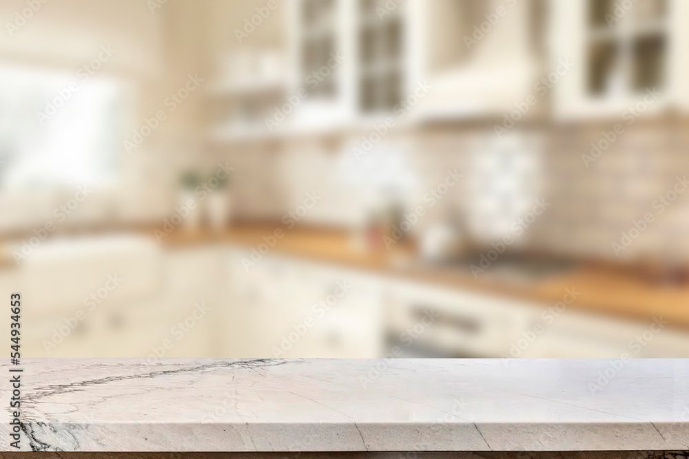 Empty marble top table with blurred kitchen interior Background. for product display.
Empty marble top table with blurred kitchen interior Background. for product display.