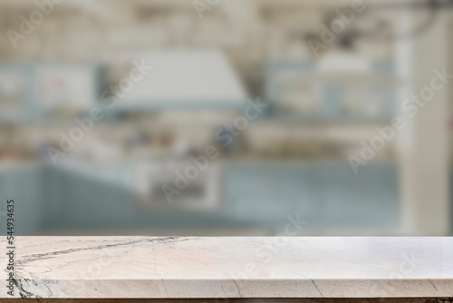 Empty marble top table with blurred kitchen interior Background. for product display.

