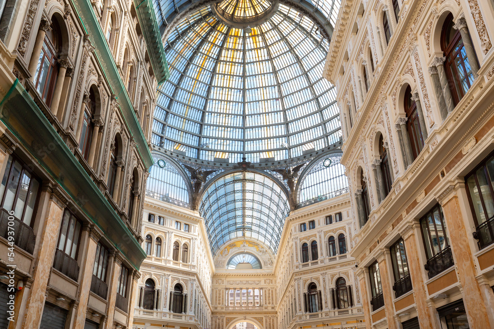 Historic public shopping gallery with old Architecture and Glass Arch Ceiling, Galleria Umberto I. Naples, Italy.