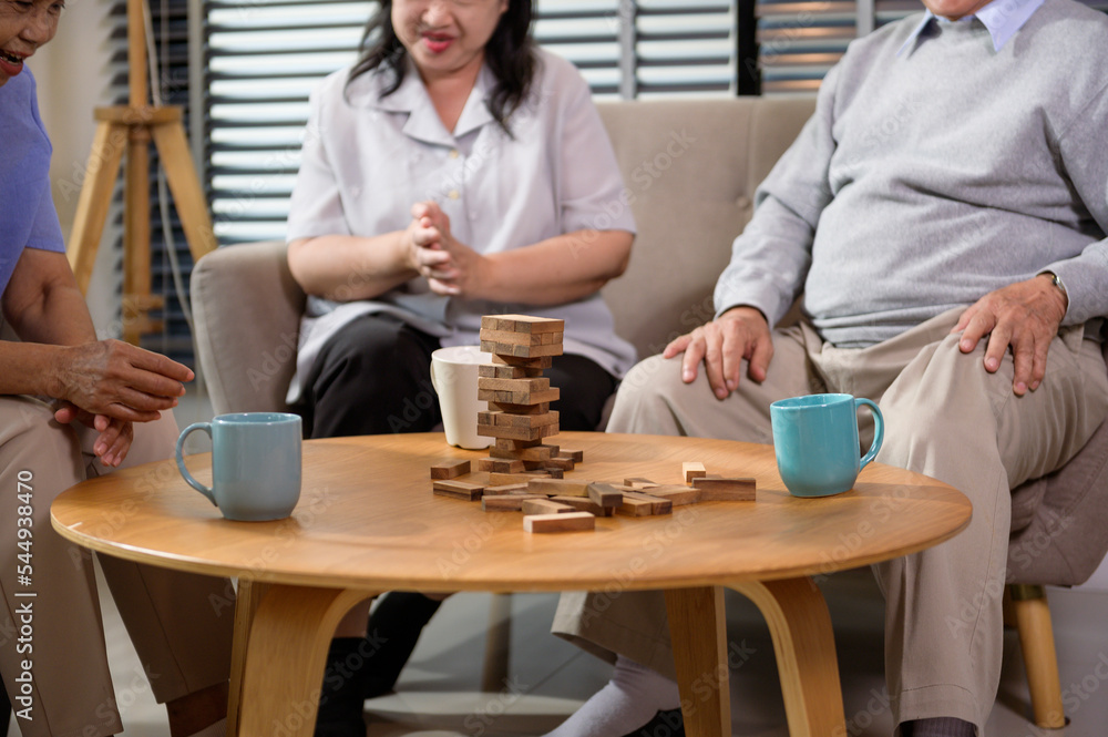 Group of elderly people enjoy talking , relaxing with game at senior healthcare center. Group of elderly people enjoy talking , relaxing with game at senior healthcare center.