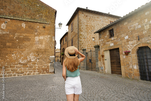 Holidays in Italy. Tourist woman visiting historic medieval town of Orvieto  Umbria  Italy.