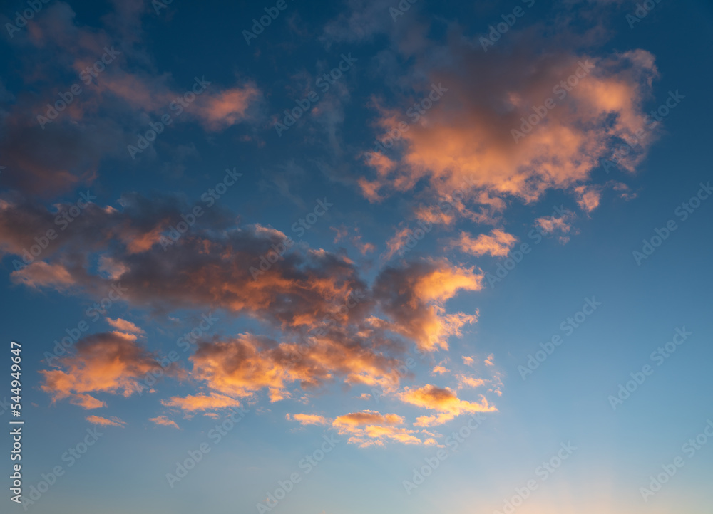 Beautiful evening sky with glowing clouds at sunset