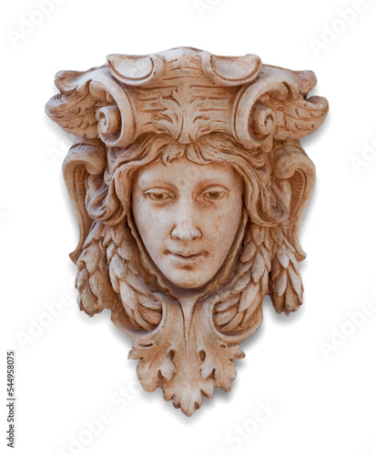 A sculpture or wall mounted Gothic style statue on white background. Decorative artifact face or mask. 