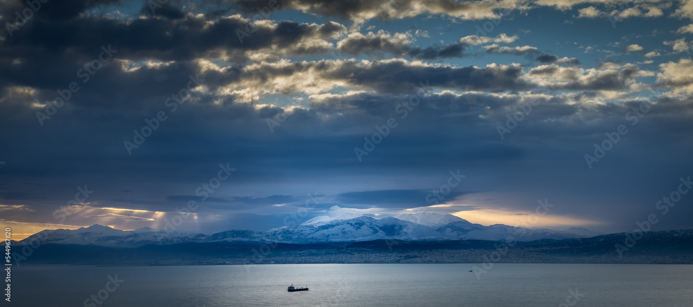 Idyllic view of seascape against mountain Idyllic view of seascape against mountain
