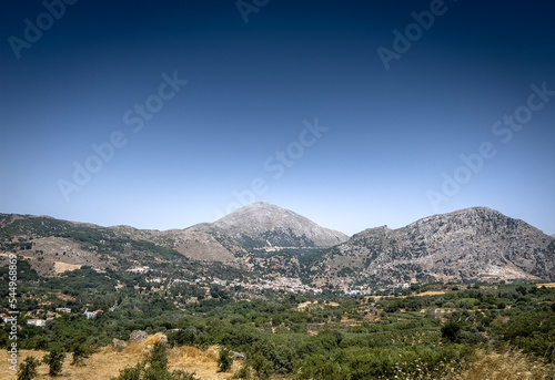 View of landscape and mountain against clear sky