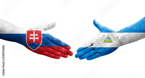 Handshake between Nicaragua and Slovakia flags painted on hands, isolated transparent image.