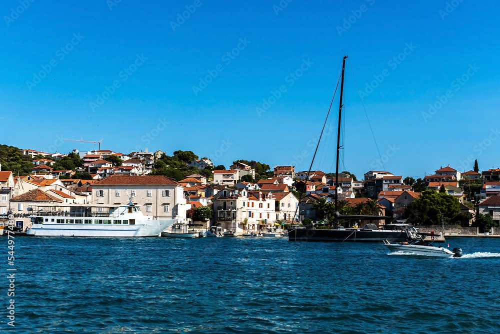 Landscape with the buildings and the harbor seen from the promenade of the old town of Trogir. Croatia. Landscape with the buildings and the harbor seen from the promenade of the old town of Trogir. Croatia.