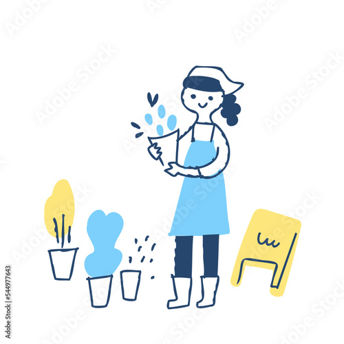花束を持っている花屋の女性