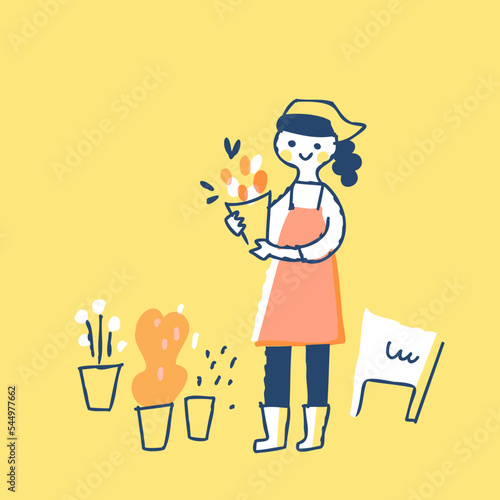 花束を持っている花屋の女性