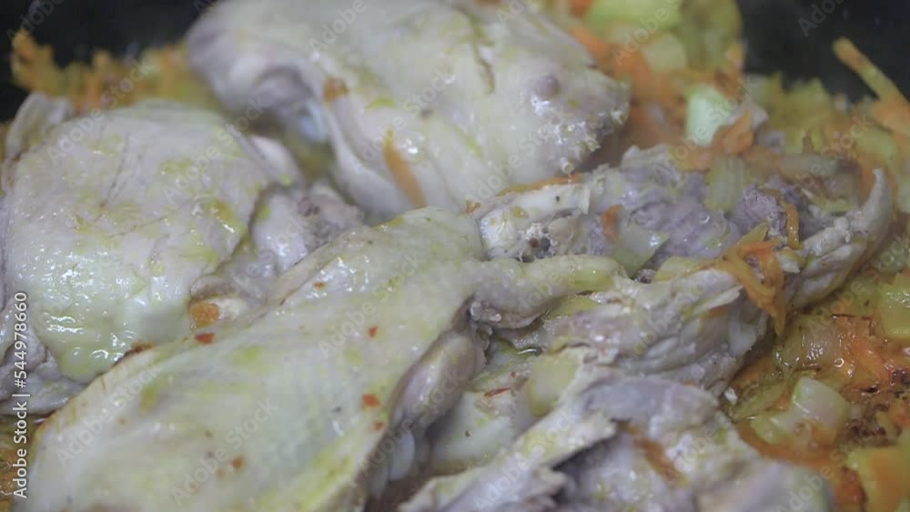 stirring with a spoon chicken backs, meat for the poor, into vegetables fried in a pan in sunflower oil, close-up
stirring with a spoon chicken backs, meat for the poor, into vegetables fried in a pan in sunflower oil, close-up