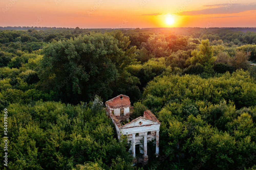 Obraz premium Old ruins of abandoned mansion overgrown by plants, aerial view. Former Verevkin manor, Kursk region