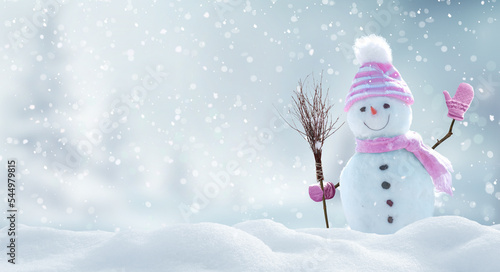 Merry christmas and happy new year greeting card with copy-space.Happy snowman standing in  landscape.Snow background.Winter fairytale.