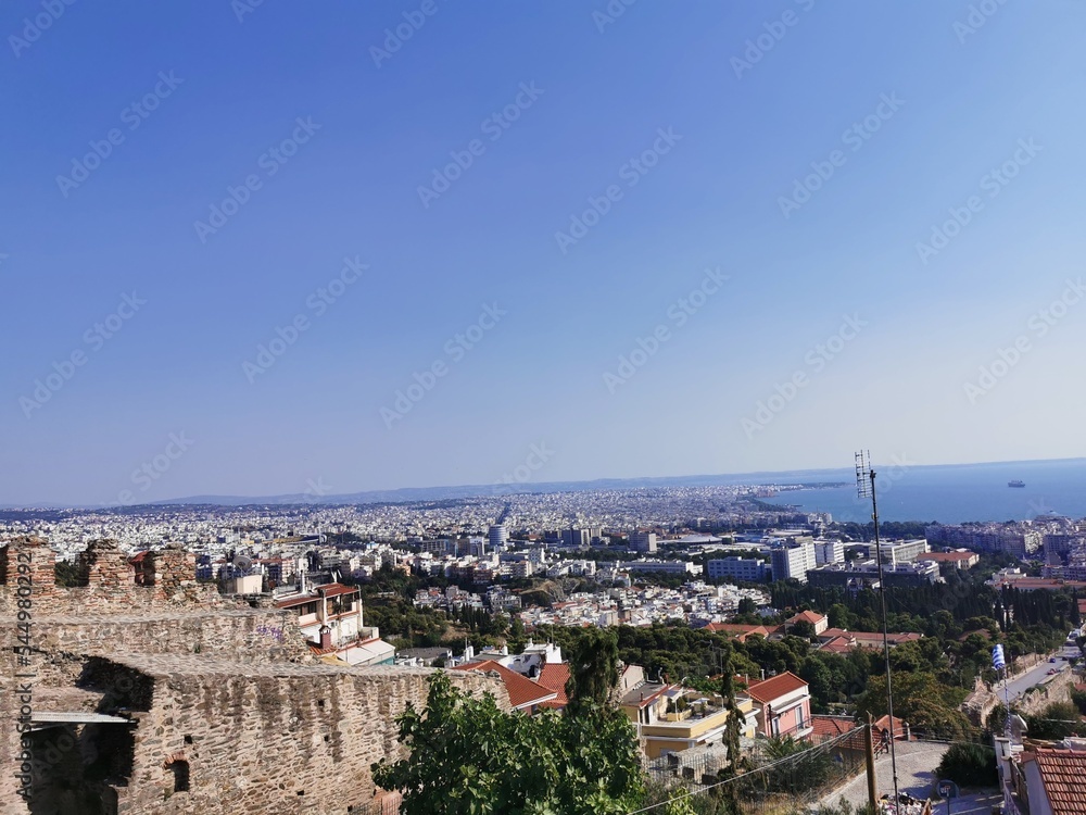 
View of the city from the mountain. Greece, the city of Thessaloniki, an observation deck for tourists. Modern city and view of the mediterranean sea