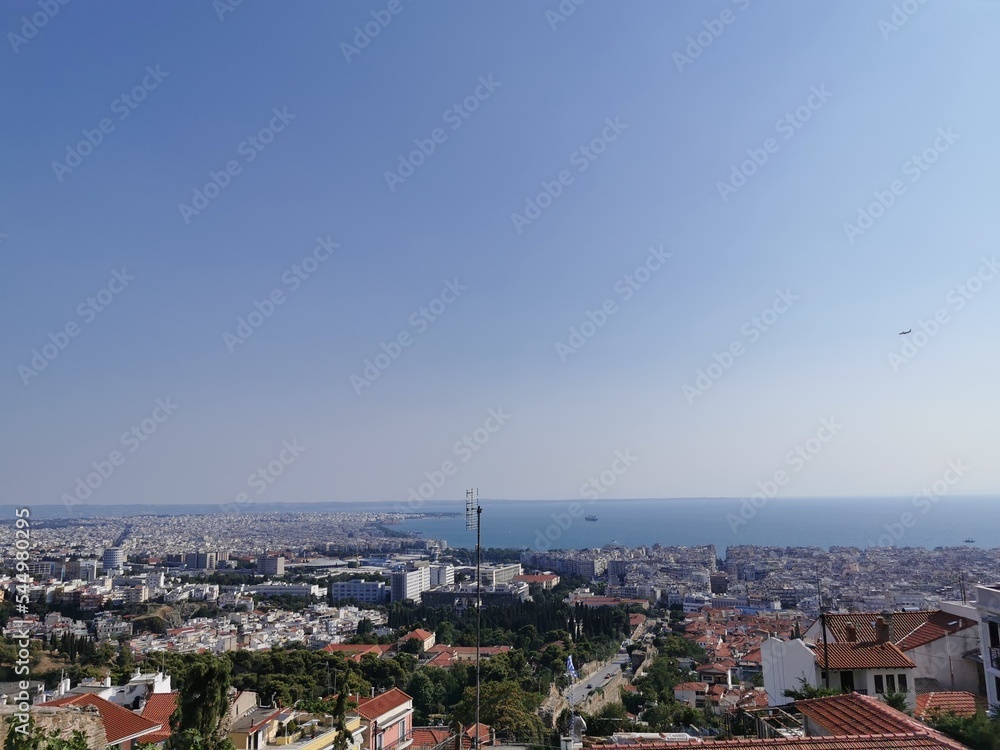
View of the city from the mountain. Greece, the city of Thessaloniki, an observation deck for tourists. Modern city and view of the mediterranean sea
