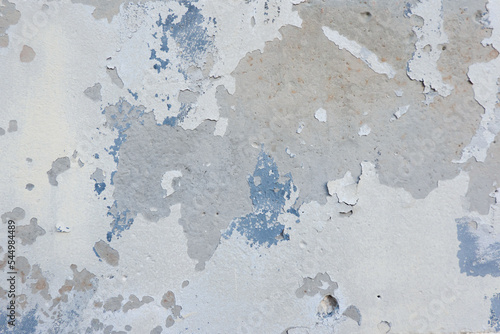 White grunge old concrete stucco wall texture background. Abstract weathered peeled plaster wall with falling off flakes of paint background © vejaa