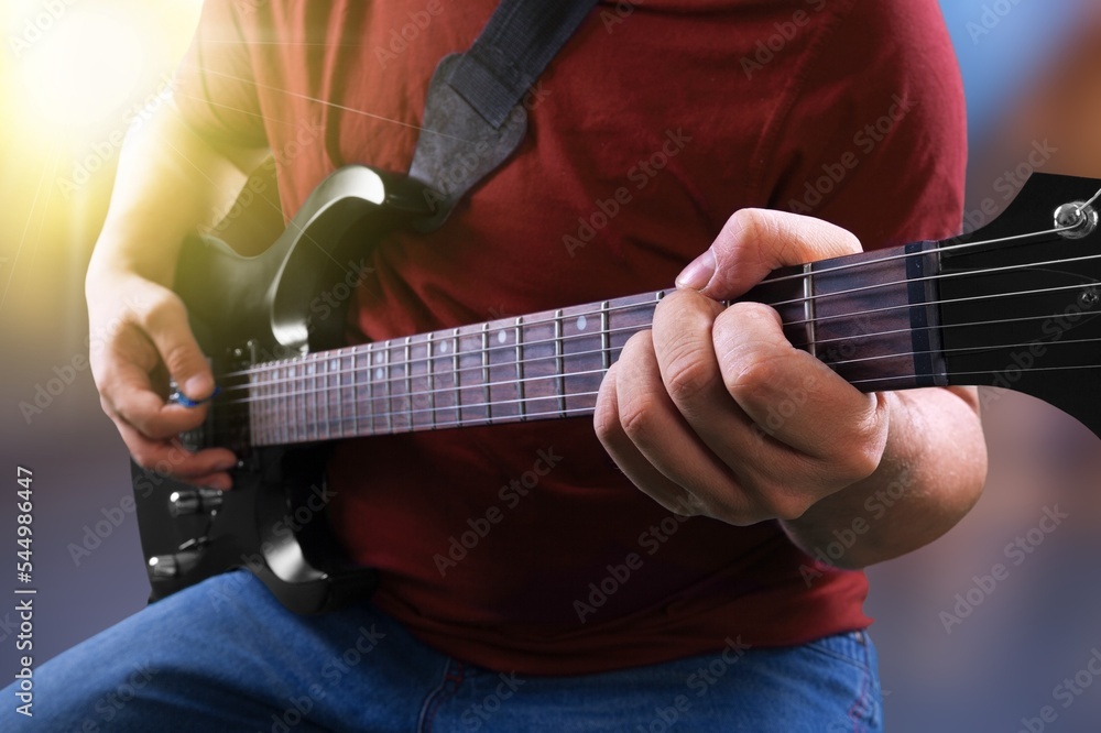 Guitarist young man with modern guitar Guitarist young man with modern guitar