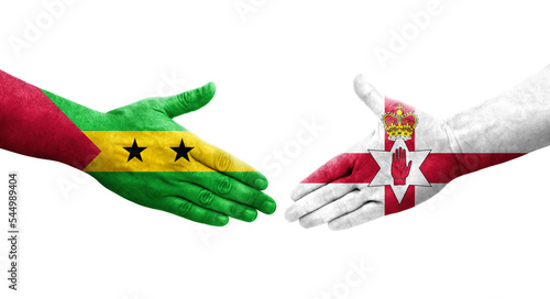 Handshake between Northern Ireland and Sao Tome and Principe flags painted on hands, isolated transparent image. photo