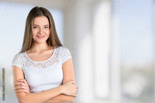 Young happy woman with crossed hands Free Download Young happy woman with crossed hands - GFXLoad